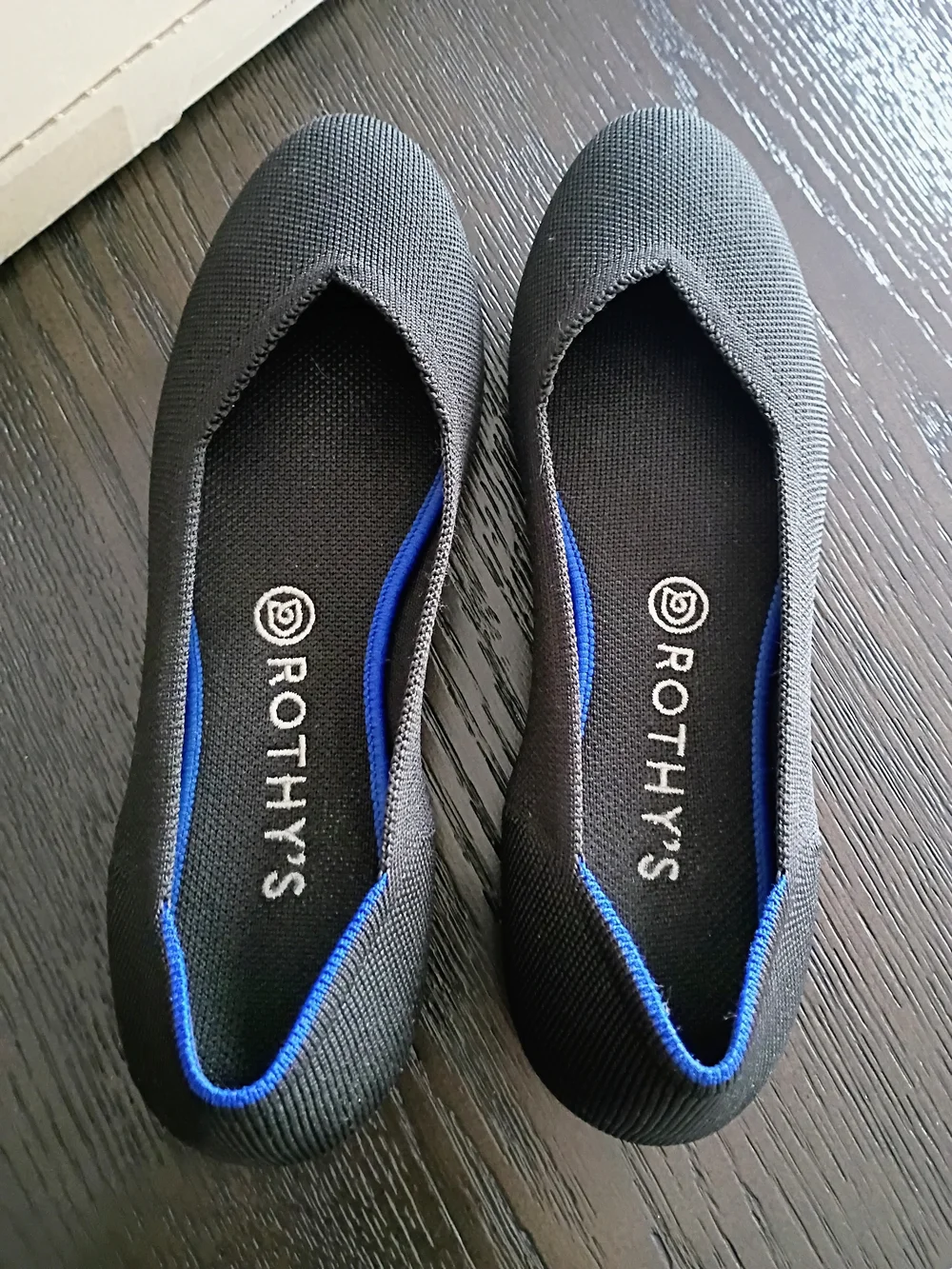Rothy's Women's Black Slip-On Flats with Blue Trim